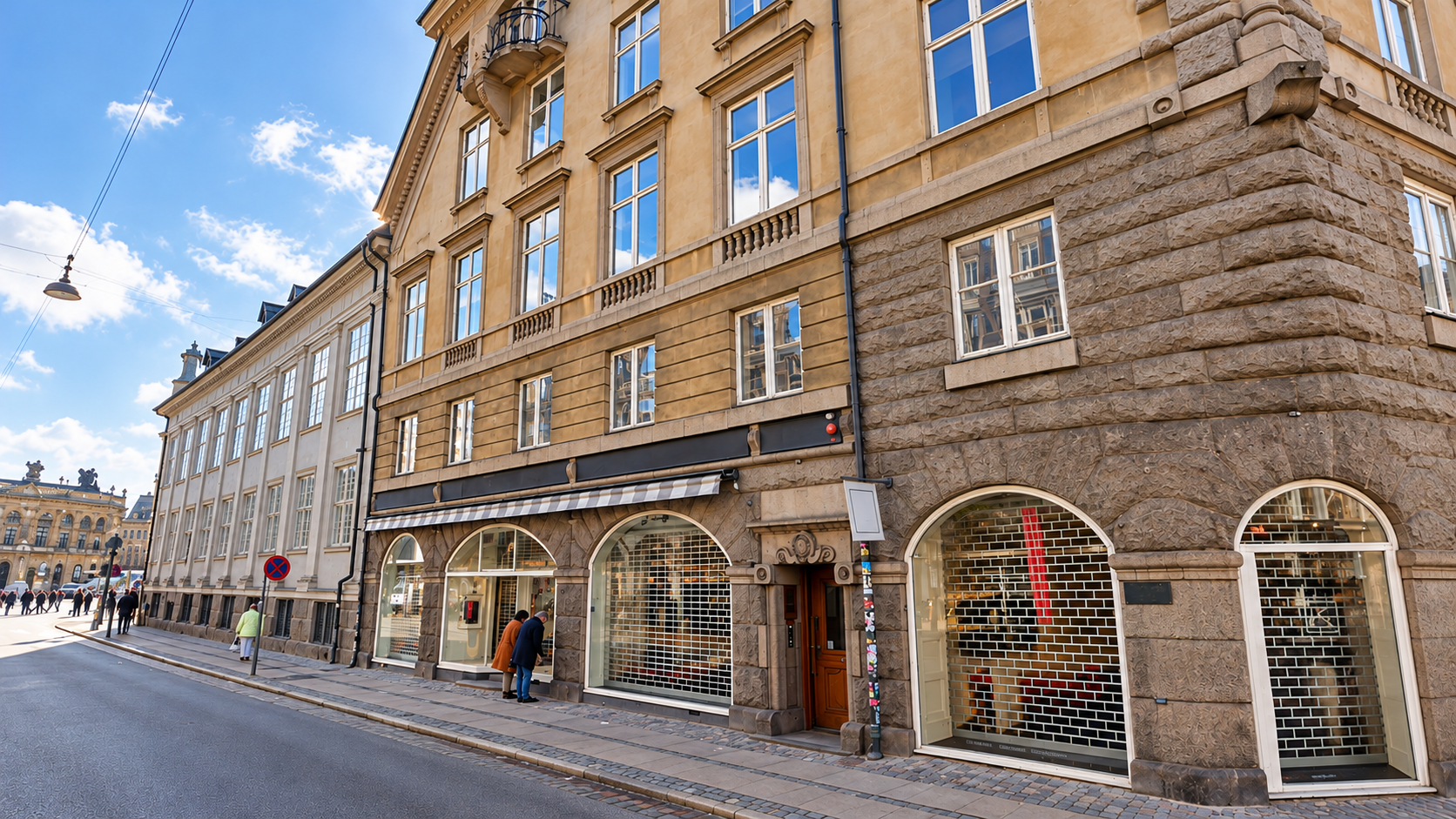 Fotorealistisk visualisering af facaden på Bredgade 3 med stenbeklædt stueetage og sammenhængende nabobygninger